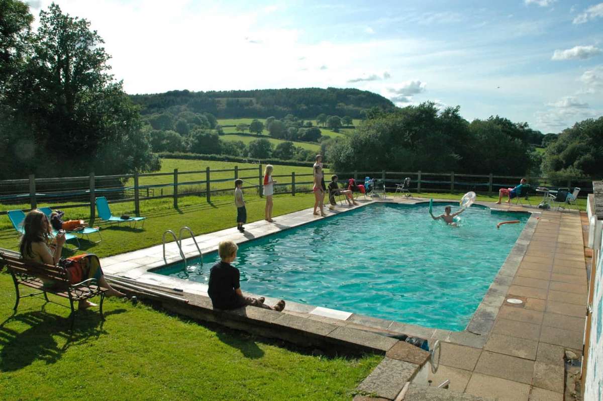 Lake cottage use of the outdoor swimming pool with stunning views