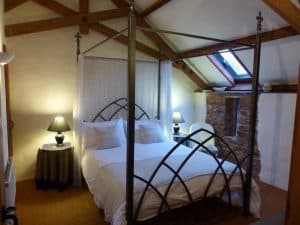 The Dairy with a four poster metal bed frame
